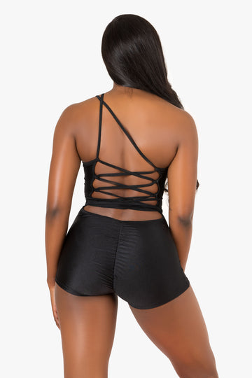 Mono negro con cordones en la espalda